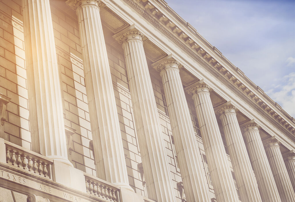 Tall classical columns on a neoclassical government building.