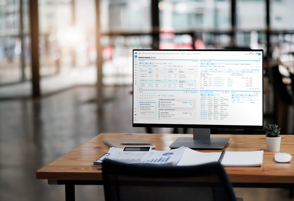 Case management software dashboard displayed on an office monitor.